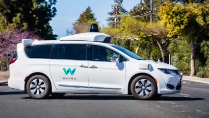 White Waymo autonomous minivan