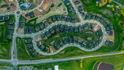 Aerial overhead view of single-family neighborhood with some houses under construction