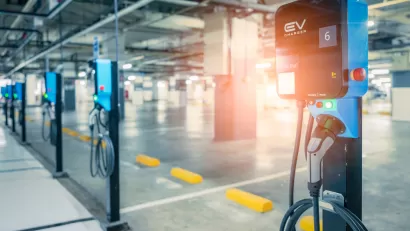 Close-up of row of electric car charging stations in a covered garage structure