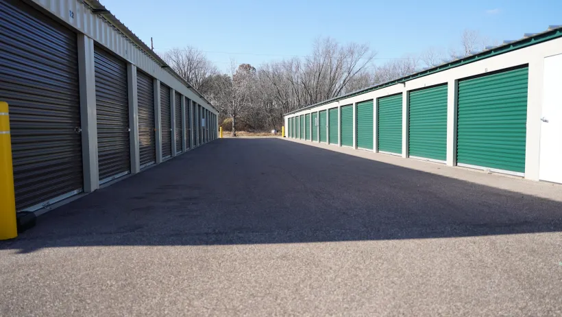 self storage facility with green doors.