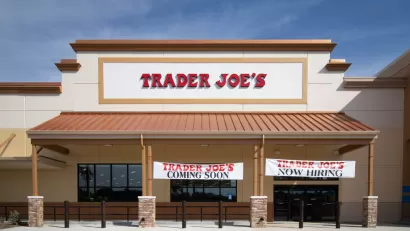 Trader Joe's building with "Coming Soon" and "Now Hiring" banners