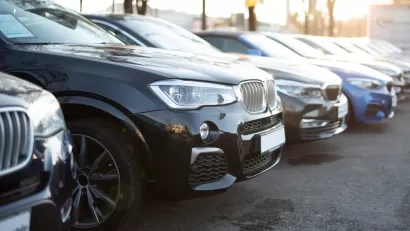 Row of cars in parking lot