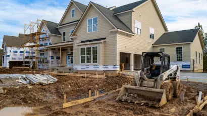 Single-family house with two-car garage under construction