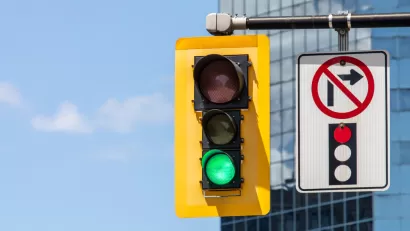Stoplight with green light and "no right turn on red" pictograph on overhead signal