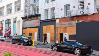 Vacant boarded-up storefronts along Powell Street in San Francisco, California.