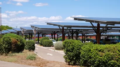 Solar panels shading cars in parking lot in Avignon, France