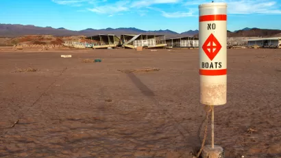 "No Boats" sign on dry Lake Mead bed
