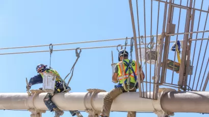 Worker performing maintenance work on the Brooklyn Bridge, New York City