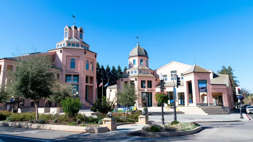 Pink Spanish-style building for Mountain View City Hall in Mountain View, California.