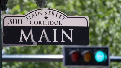 Main Street Sign with Traffic Light in the Background in Downtown Houston, Texas