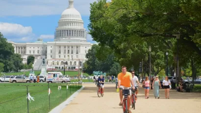 People on bikes in front of the U.S. Capitol in Washington, D.C.