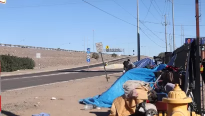 Tents belonging to unhoused people near freeway onramp in Phoenix, Arizona