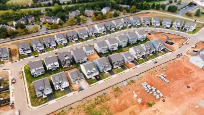 Aerial view of dense single-family homes in neighborhood still under construction