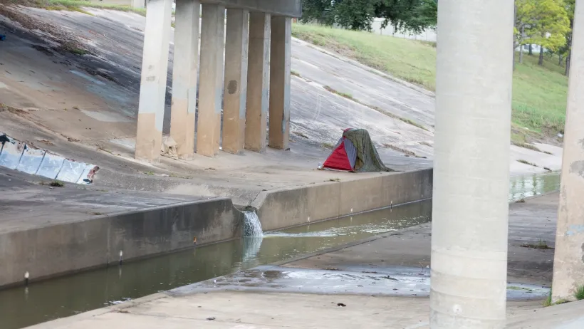 Tent pitched under freeway overpass in Houston, Texas.
