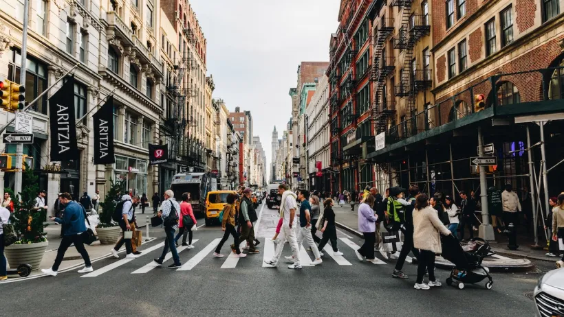 Pedestrians in NYC cross the street.