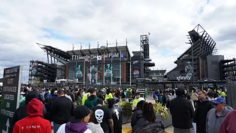 Crowd of fans in front of Philadelphia's Lincoln Field stadium.