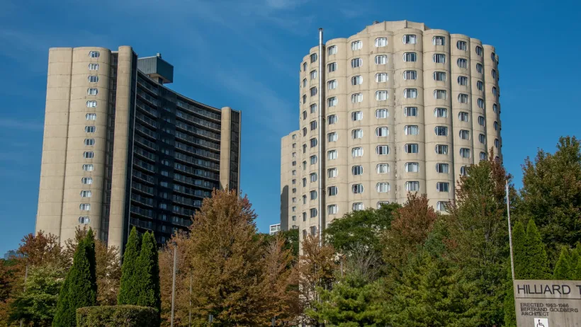 Round modernist concrete public housing towers with arched windows in Chicago, Illinois.
