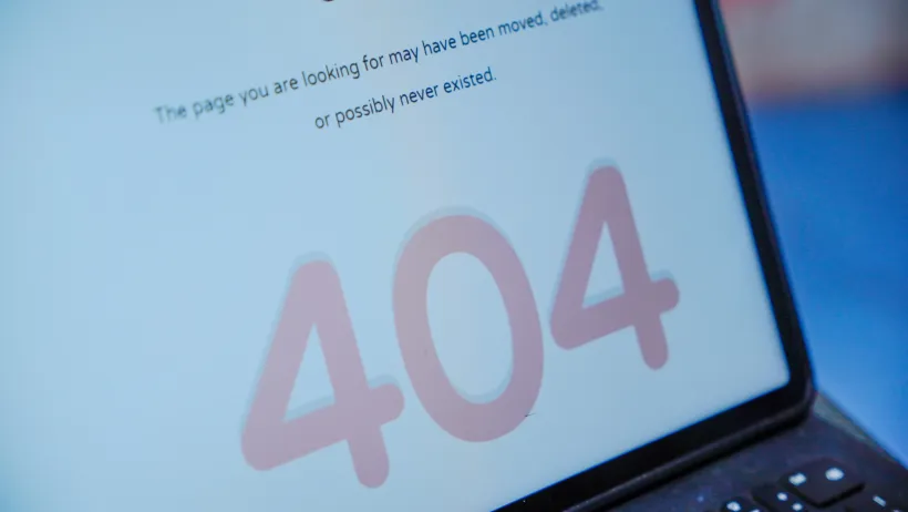 Close-up of laptop screen with 404 error.