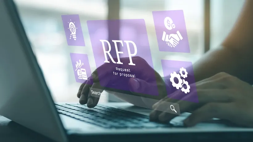 Person typing on laptop with RFP graphic