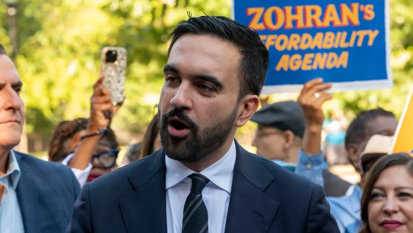 Close-up on NYC mayor Zohran Mamdani during an election event.