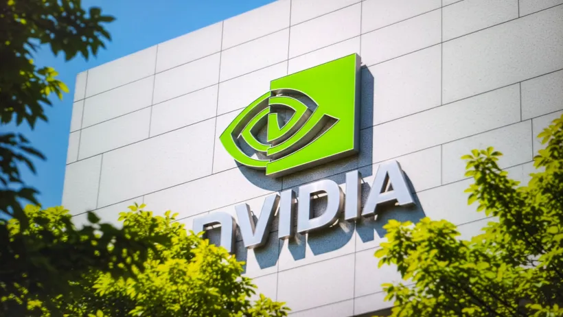 Green Nvidia eye-shaped logo on white building.
