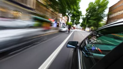 Blurry speeding cars on an urban road