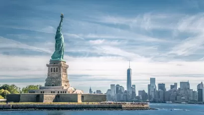View of Statue of Liberty with New York City skyline in background