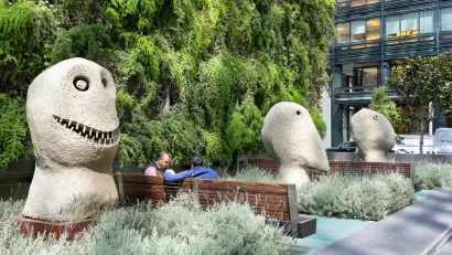 A privately owned public space at 555 Mission Street with large sculptures and benches.