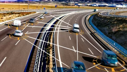 Photo of cars on two-way separated highway with illustrated lines between them indicating tech-driven decisions