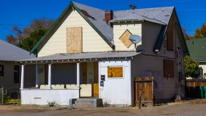 Boarded up, vacant house