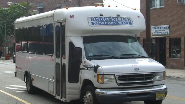 White 'dollar van' commuter transit minibus in New York City.