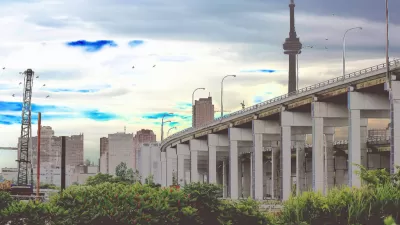 CN Tower rises above Gardiner Expressway on Toronto Waterfront