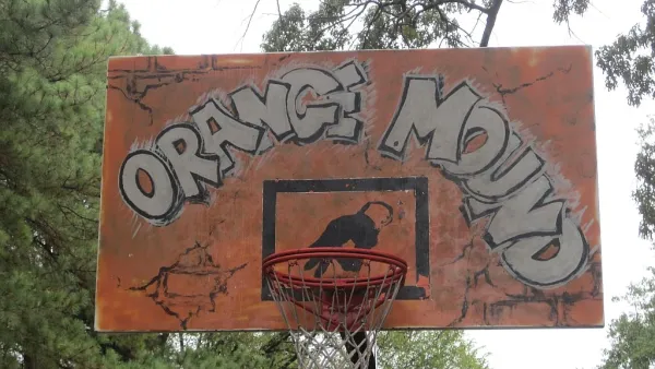 The backboar of a basketball hoop is painted orange with the words "orange Mound"--the name of a historically black neighborhood in Memphis, Tennessee.