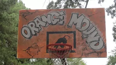 The backboar of a basketball hoop is painted orange with the words "orange Mound"--the name of a historically black neighborhood in Memphis, Tennessee.