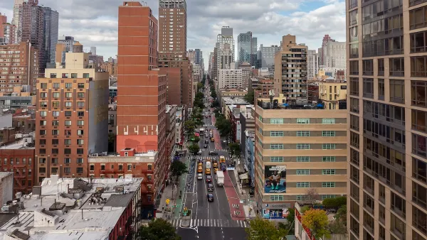 A view of NYC sky rises under a cloudy sky.