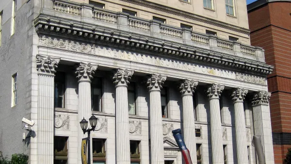 Historic Firemen's Insurance building in Newark, NJ with neoclassical columns.