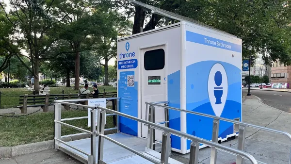White and blue modular Throne public restroom outdoors in Washington DC.