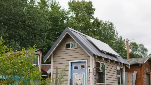 A tiny home in a Portland community with a solar panel on the roof.