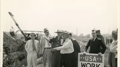 Eleanor Roosevelt talking with a project superintendent in Des Moines, Iowa. June 8, 1936. This project, sponsored by the Works Progress Administration, planned to convert a city dump into a water front park.