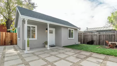 Small grey accessory dwelling unit cottage in California backyard
