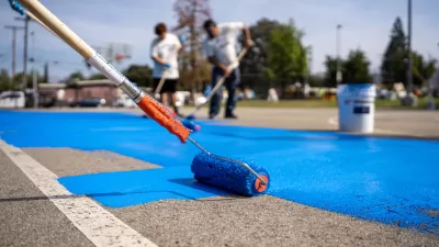 Paint roller coating basketball court with blue cooling coating