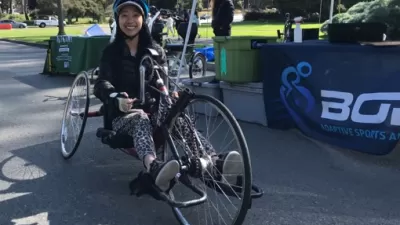 Woman sitting on recumbent bike