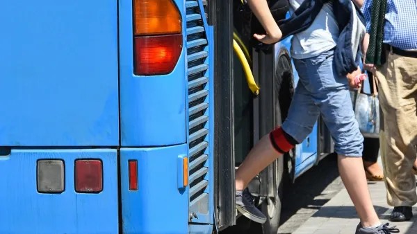 Passengers exiting the back door of a blue public bus.