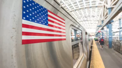 Close-up of American flag sticker on a silver subway train.