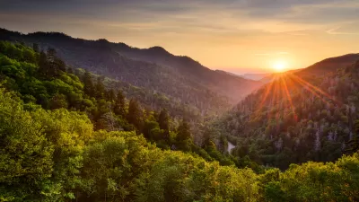 View of wooded mountains with sunset in background in the Smoky Mountains.