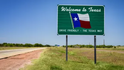 "Welcome to Texas" road sign with Texas flag and "Drive Friendly - the Texas way" slogan
