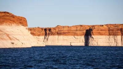 "Bathtub ring" showing low water level on red rocks at Lake Powell, Arizona
