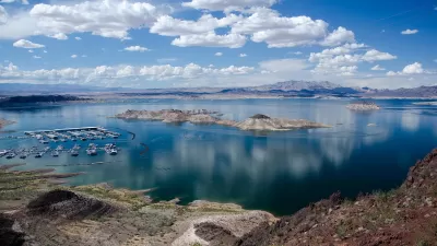 Lake Mead on the Colorado River with boats in a marina and clear low water line.