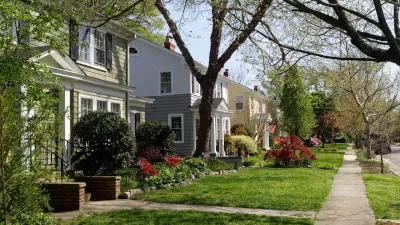Two-story houses on tree-lined street in Richmond, Virginia