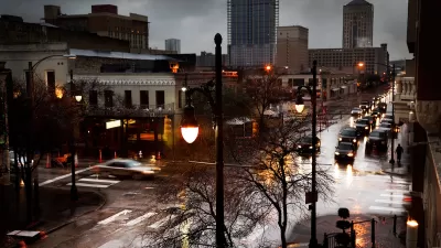 View of rainy Sixth Street with grey sky in Austin, Texas